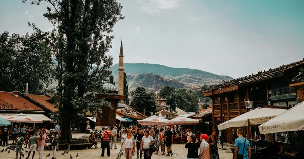 A cobblestone street in Sarajevo's old town with historic buildings