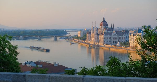 The Hungarian Parliament building on the Danube in Budapest at sunset