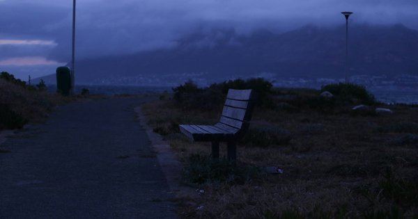 A quiet park path at dusk