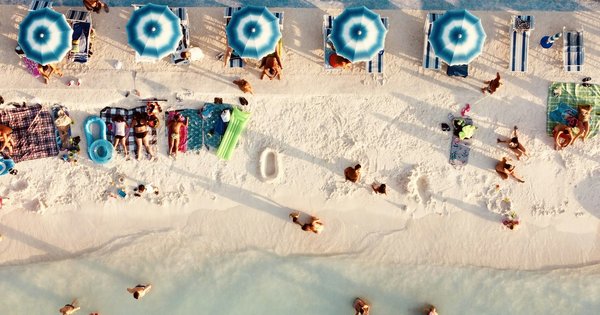 Turquoise Adriatic water along a beach club coastline in Croatia