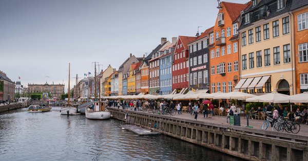 Colorful buildings line a canal in Copenhagen, Denmark