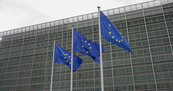 European Union flags flying outside a government building