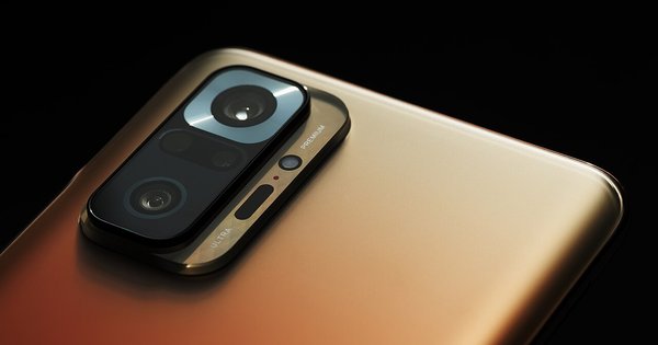 A smartphone lying face up with its screen lit
