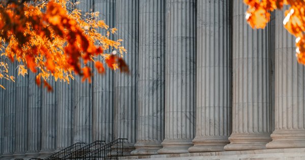 Exterior of a courthouse column and steps under bright daylight