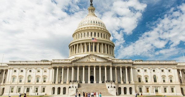 The U.S. Capitol building under a cloudy sky