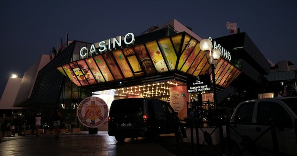 A casino entrance lit up at night