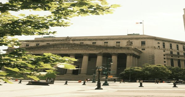 Exterior of a federal courthouse building with columns