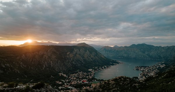 The old town of Kotor, Montenegro, seen from the water with mountains behind