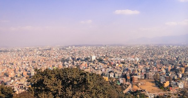 The hills and skyline of Kathmandu, Nepal, with prayer flags in the foreground