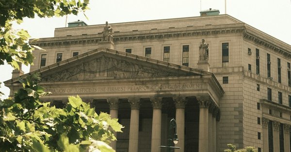 The exterior of a federal courthouse with columns