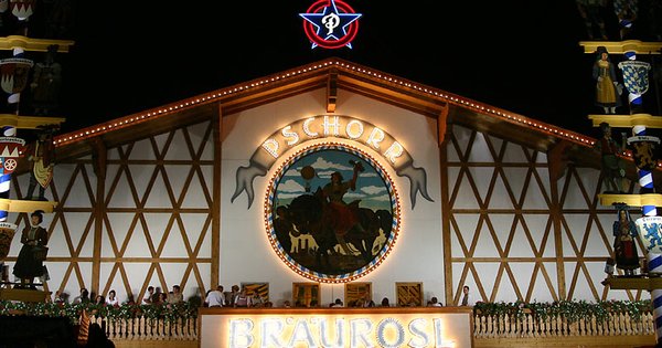 The illuminated facade of the Pschorr Bräurosl beer tent at Munich's Oktoberfest at night