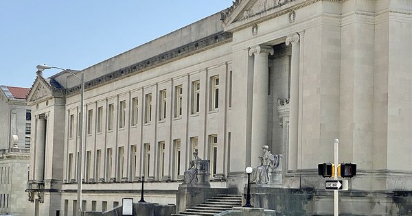 The columned stone façade of an American county courthouse