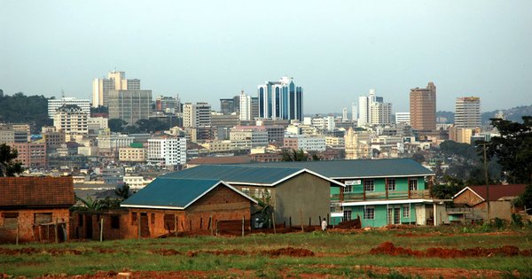 The Ugandan parliament building in Kampala under a clear sky