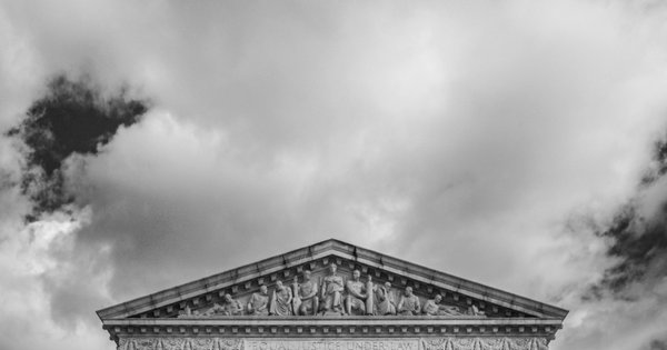 The U.S. Supreme Court building under a clear sky