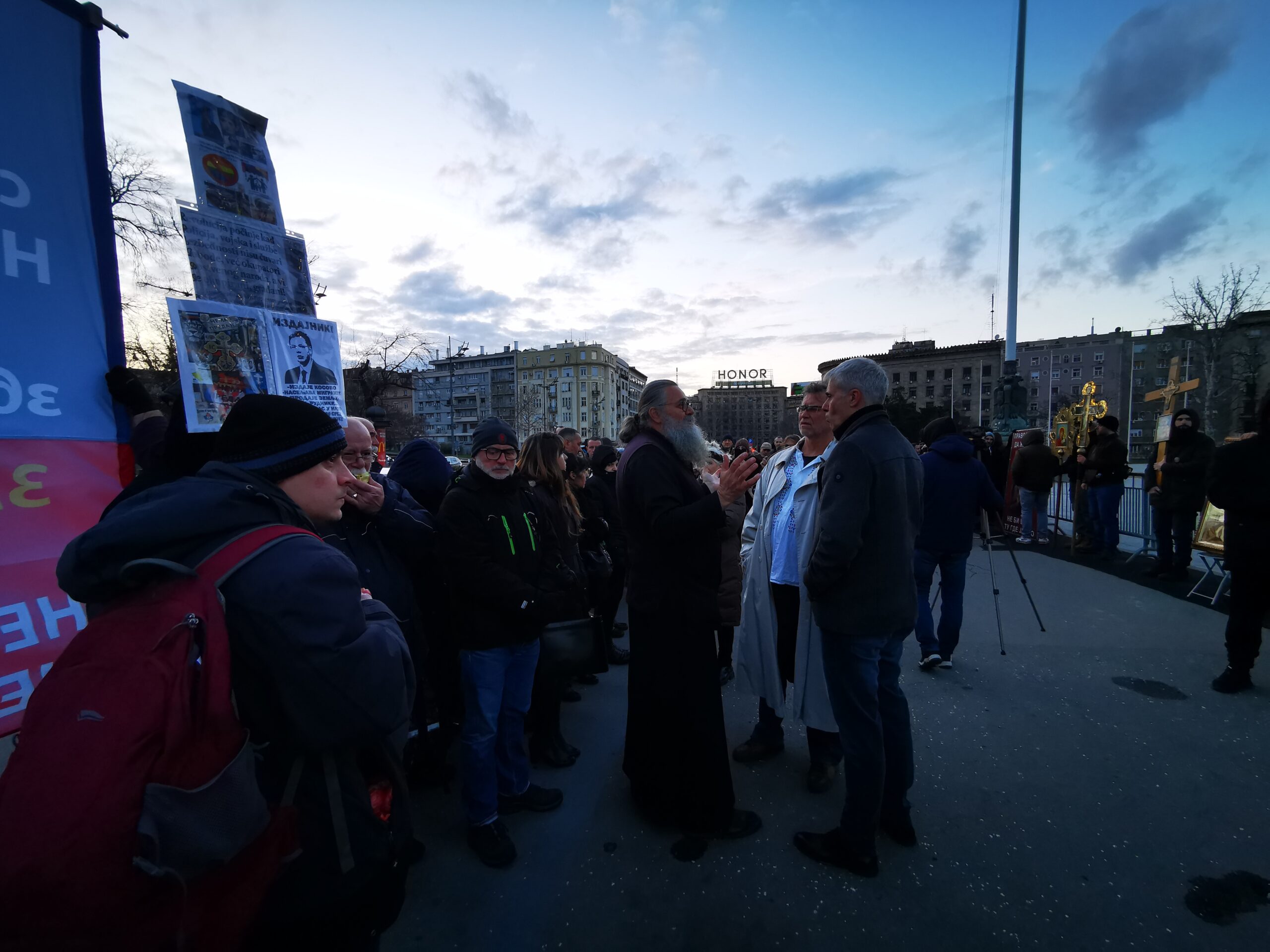 A group of protesters called for people's attention in front of the parliament building in Belgrade.