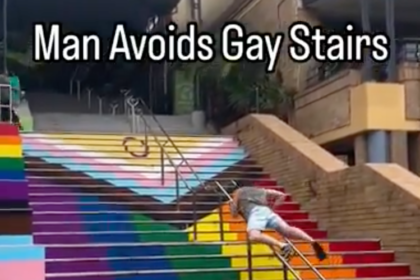 Australian man awkwardly humps his way up a set of railings to avoid using ‘woke’ Pride stairs
