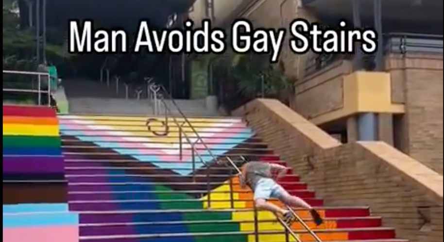 Australian man awkwardly humps his way up a set of railings to avoid using ‘woke’ Pride stairs