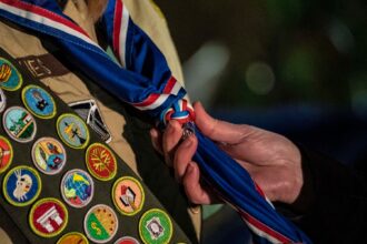 Boy Scouts rebranding sparks conservative backlash.