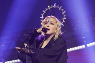 Inspiring - Fan bravely sues Madonna for tour 'porn'.